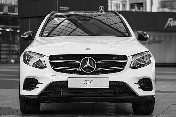 Munich, Germany - May 6, 2016: New model of elegant Mercedes-Benz GLC second generation crossover SUV. Black and white outdoor stock photo was captured in a public place with free access.